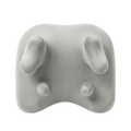 Gray cushion with rounded edges and small protrusions on a white background
